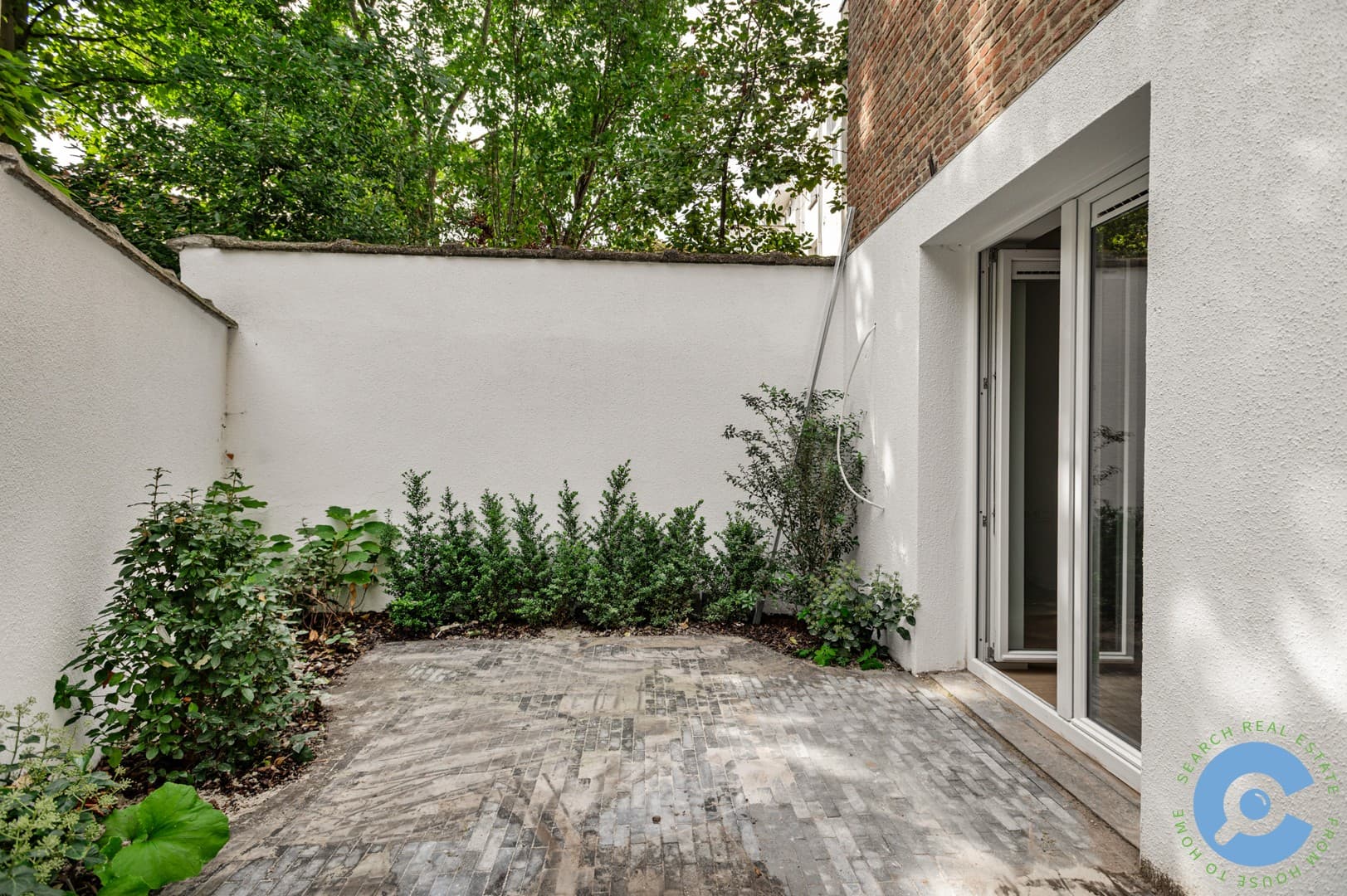 Gerenoveerd gelijkvloers appartement met terras! 9